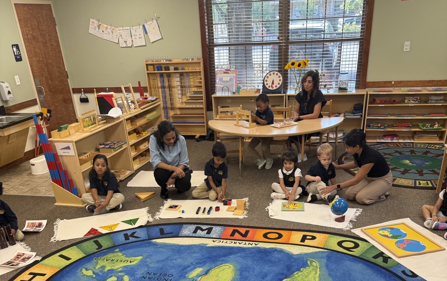 teachers helping children learn