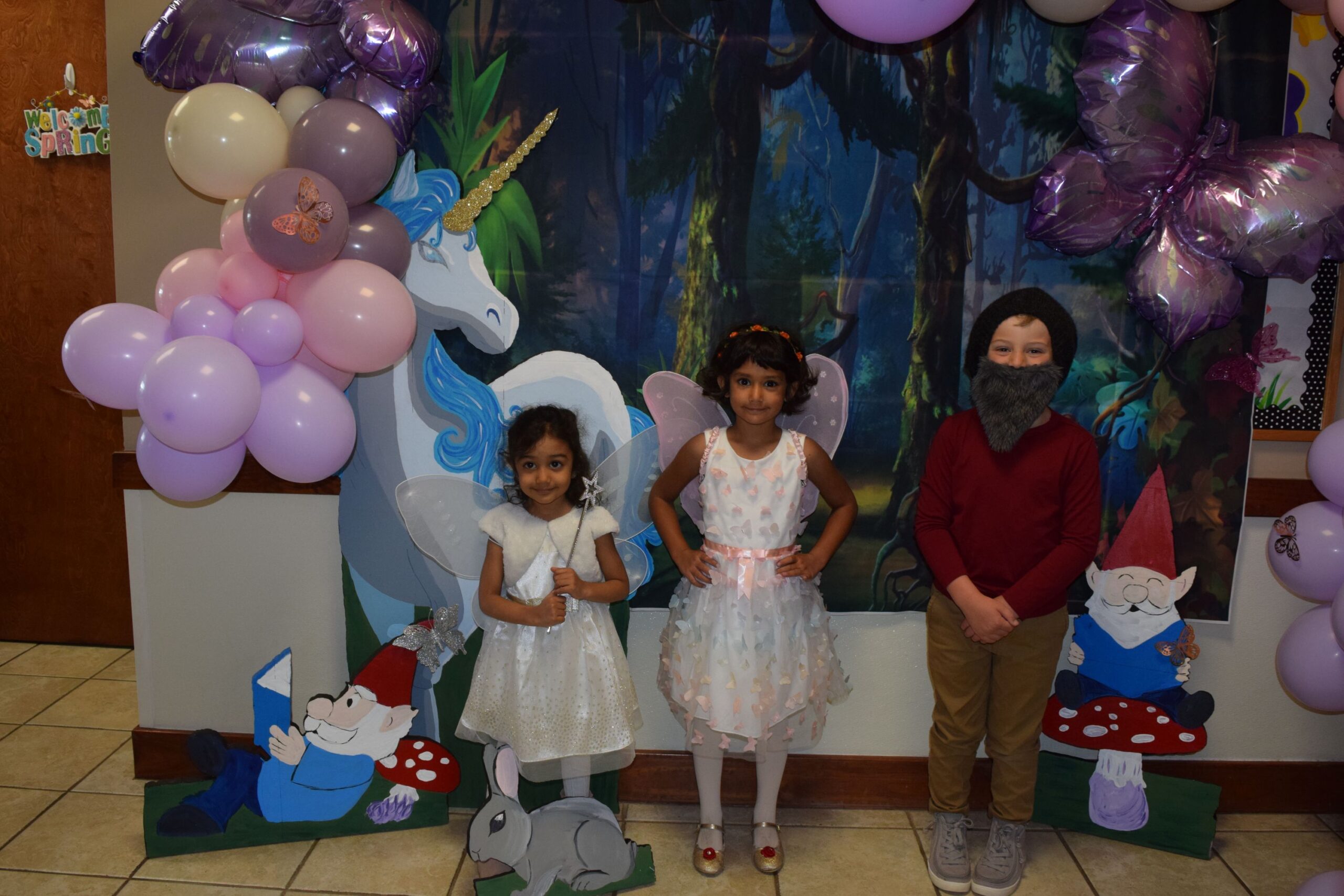 kids playing dress up reading storybooks