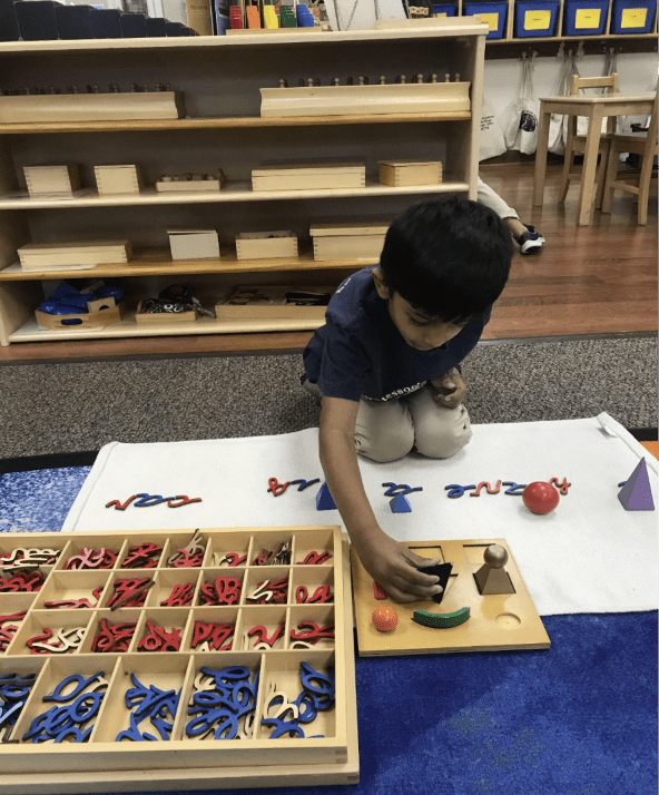 Child using Cursive Blocks